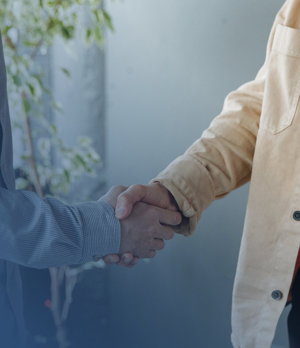 A lawyer shaking hands with a client