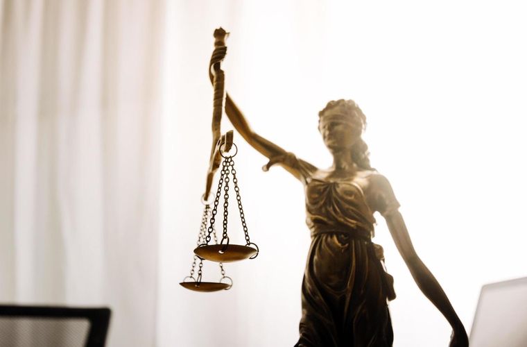 Scales of justice on a lawyer&rsquo;s desk